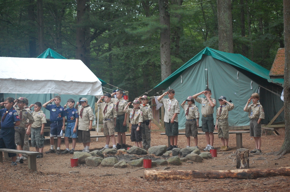Scouts in front of tents